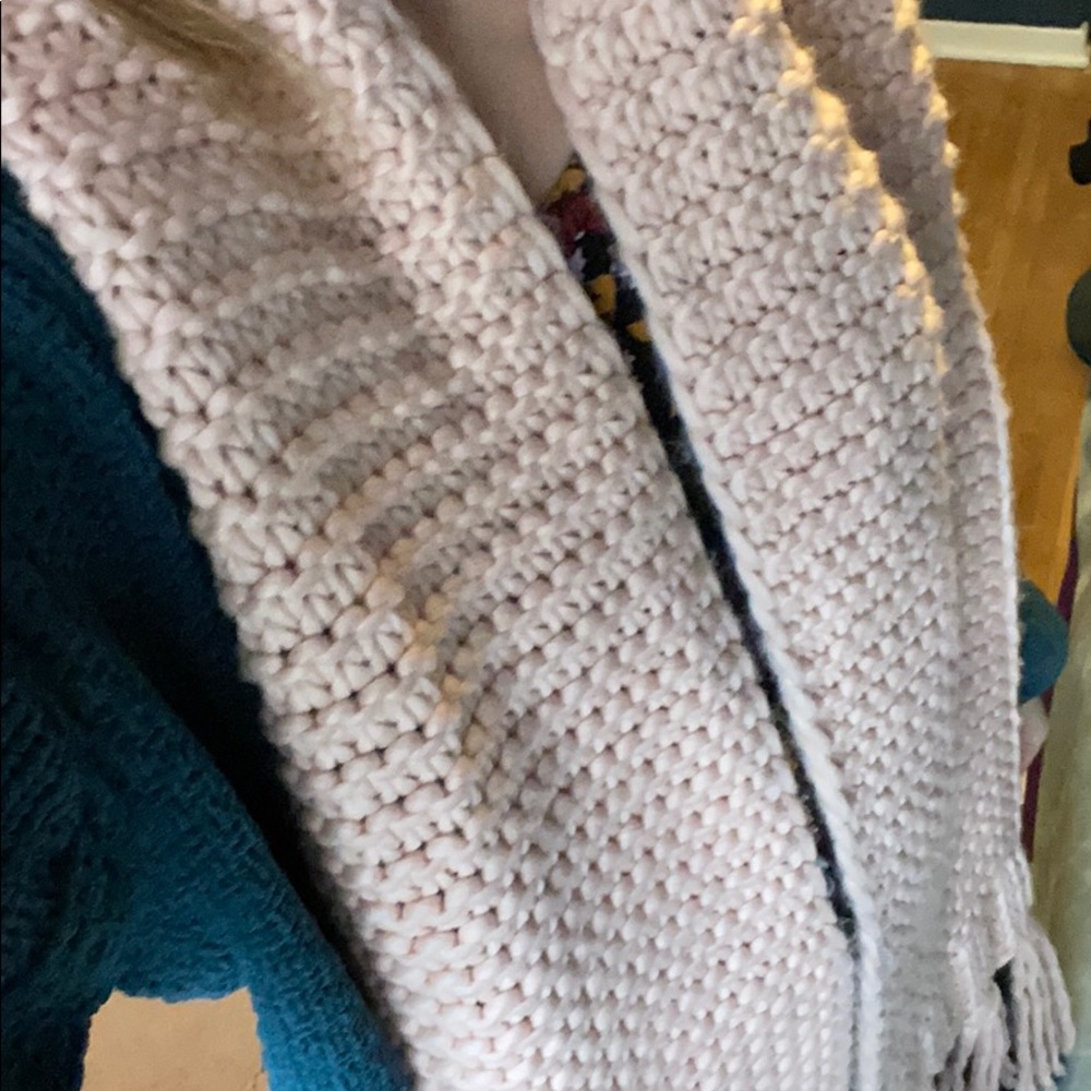 Pink knit fringe scarf